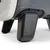 Close-up of the sturdy black feet of a transport box with a grey surface.