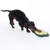 Dachshund playing with an avocado-shaped fabric dog toy.
