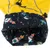 Impermeabile giallo con fodera interna nera, stampato con razzi, pianeti e la scritta 'Space Fun'.