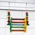 Colourful wooden toy with chain suspension, suitable for bird cages. Includes coloured wooden beads and rods attached to metal chains.