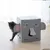 Grey play box in elephant shape with openings, suitable as a hideout or play area for pets. Cat emerging from a side opening.