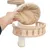 Hand showing removable, padded cushion made of beige fabric on a scratching post with wooden platform and sisal post.