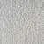 Gros plan sur une surface en tissu polaire gris, texture bouclée visible. Matériau utilisé pour accessoires ou couchages pour animaux.