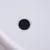 Black round felt glider on white surface, suitable for furniture or flooring.