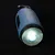 Blaue Taschenlampe mit leuchtender LED-Linse und schwarzem Griff.