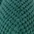 Gros plan sur une surface en tissu tricoté vert, texture bouclée visible. Matériau textile uniquement, aucun autre élément identifiable.