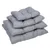 Quatre coussins gris pour animaux, empilés par taille croissante, étiquette visible sur le côté de chaque coussin. Matière textile rembourrée.