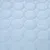 Jasnoniebieska tkanina z okrągłym wzorem pikowania, odpowiednia na poduszki lub legowiska dla zwierząt.