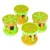 Four plastic toy rollers in green and yellow with integrated red bells. Suitable for interactive play.