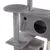 Grey scratching post with multiple levels, round platforms and caves made of soft fabric. Visible openings for access to the caves.