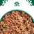 Close-up of wet food with meat pieces, carrots, peas and rice in a green bowl. Logo with tree, dog and cat visible at the top.