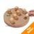 Karlie wooden round puzzle board with eight pegs, one peg lifted by a hand to reveal a treat inside. Orange corner banner reads 'Top Seller'.
