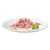 Tender meat pieces in sauce on a white plate, garnished with fresh parsley.