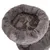 Panier rond en tissu peluche gris avec rebord rembourré et motif floral visible sur la surface intérieure et extérieure.