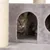 Grauer Kratzbaum mit Sisalstämmen und Höhle, Katze sitzt in der Höhle.