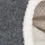 Close-up of grey felt material with white plush edge, suitable for pet products such as beds or caves.