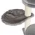 Grey hammock made of soft fabric, attached to a scratching post with sisal posts.