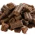 Friandises brunes en forme de bâtonnets courts, sans emballage visible ni marque apparente.