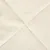 Close-up of a cream-coloured, soft fabric with diagonal seams. Material texture visible.
