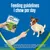 Feeding guideline: one chew per day. Image shows a hand offering a dental chew to a small dog, with advice to provide fresh water and supervise during treat giving.