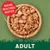 Bowl of meaty chunks in gravy with text 'Making Mealtimes Meatier' and 'Adult' shown, indicating food for adult pets with a focus on meat content.
