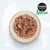 Cosma Nature. Schüssel mit zerkleinertem Fleisch, natürliche Zutaten sichtbar.