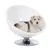 White, round pet armchair with chrome-plated base. Dog lying in the armchair.