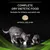 COMPLETE DRY DIETETIC FOOD. Suitable for kittens and adult cats. APPROX. SIZE 8 MM. Εικόνα με δύο γάτες που τρώνε από μεταλλικά μπολ και μία κροκέτα διαμέτρου περίπου 8 mm.
