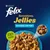 Purina Felix Sensations Jellies Selezioni con Pesci, senza coloranti. Immagine di bocconcini in gelatina su piatto azzurro.