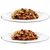 Two white plates each with chunks of brown wet pet food and visible vegetable pieces, shown on a plain background. No brand or packaging visible.