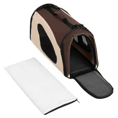Sac de transport pour animaux en tissu beige et marron, ouvert avec porte en maille noire, poignée sur le dessus et coussin blanc amovible à côté.