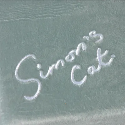 Embroidery with 'Simon's Cat' lettering on grey fabric.
