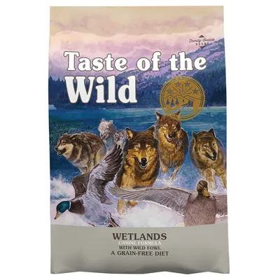 Taste of the Wild Wetlands Canine Formula with Wild Fowl, A Grain-Free Diet. Family-Owned BBAAF. Bag shows wolves and ducks in water. Gold seal with trees and stars visible.