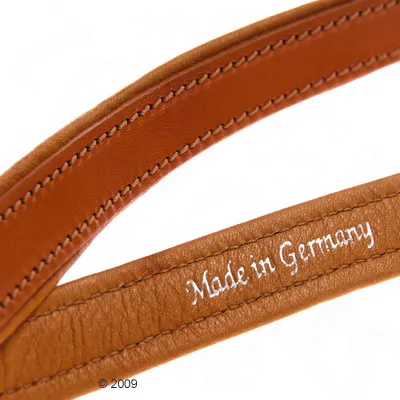 Brown leather product with white lettering 'Made in Germany'.