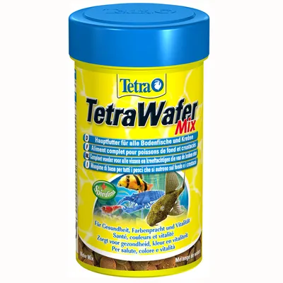 Упаковка корма для рыб TetraWafer Mix, видны надписи: Hauptfutter für alle Bodenfische und Krebse, Spirulina, Für Gesundheit, Farbenpracht und Vitalität. Изображены рыбы и раки.