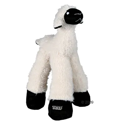 Mjuk leksak i form av ett får med vit päls, svart nos och svarta ben. Märket TRIXIE synligt på ena benet.