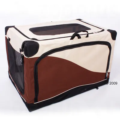 Foldable fabric pet crate in beige and brown with black mesh panels, zip openings on the front and top, and carry handles visible on top.