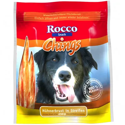 Rocco Snack Chings -kanafileesuikaleet, 250 g. Pakkauksessa teksti: 100 % lihaa, ilman säilöntäaineita. Hühnerbrust in Streifen. Kuvassa koira ja kanafileesuikaleita.