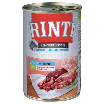Conservă Rinti Kennerfleisch Junior mit Rind, imagine cu bucăți de carne și organe pe ambalaj. Text vizibil: 'noch mehr natürliche Fleischstücke'.