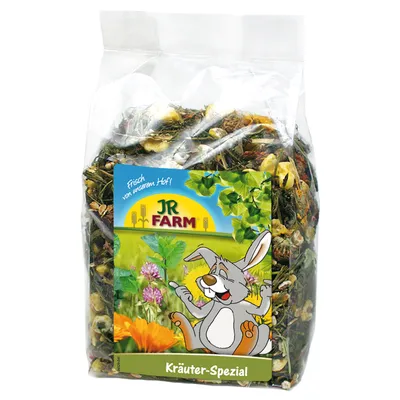 Bag labelled JR Farm Kräuter-Spezial with herbs and flowers visible inside, featuring an illustration of a rabbit and plants on the packaging.