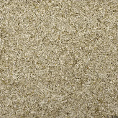 Lähikuva luonnollisesta puulastuista valmistetusta kuivikkeesta, beige väri, sopii pieneläinhäkkeihin tai jyrsijätaloihin.