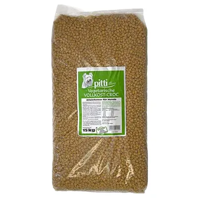 Saco de croquetas para perros pitti, etiqueta verde con texto en alemán: Vegetarische VOLLKOST-CROC, 15 kg. Ingredientes y tabla nutricional visibles en la etiqueta.
