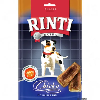 Embalagem de snacks para cães Rinti Extra Chicko, com imagem de cão, pedaços de snack e texto visível: '100% Filet', 'Mit Huhn & Ente', 'Fettreduziert', 'Luftgetrocknet'.