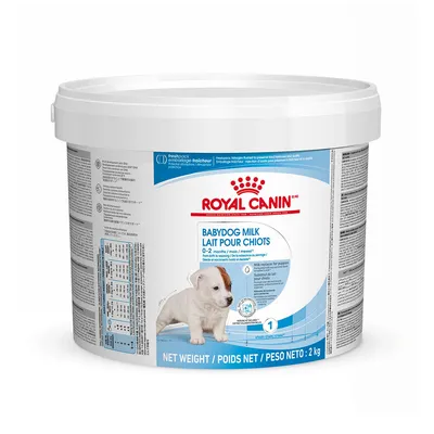 Royal Canin Babydog Milk 0–2 månader, mjölkersättning för valpar, nettovikt 2 kg. Synlig utfodringstabell och information på förpackningen.