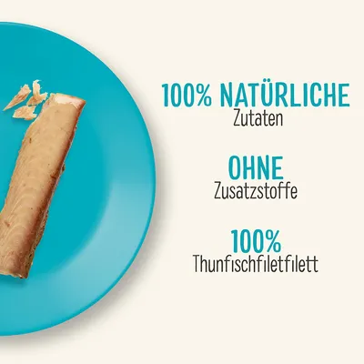 Текст на немецком: 100% NATÜRLICHE Zutaten, OHNE Zusatzstoffe, 100% Thunfischfiletfilett. Изображение куска тунца на голубой тарелке.