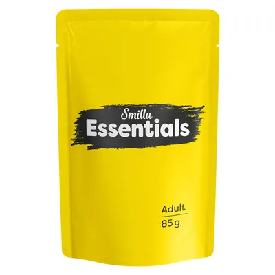 Smilla Essentials Adult 85 g pose med tydelig sort og hvid tekst på gul baggrund. Synlig produktnavn og vægtangivelse.