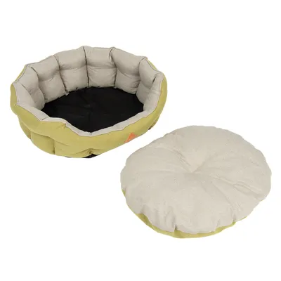 Rund hunde- eller kattekurv i stof med aftagelig, polstret pude ved siden af. Yderside lysegrøn, inderside og pude beige. Ingen synlige mærker eller tekst.