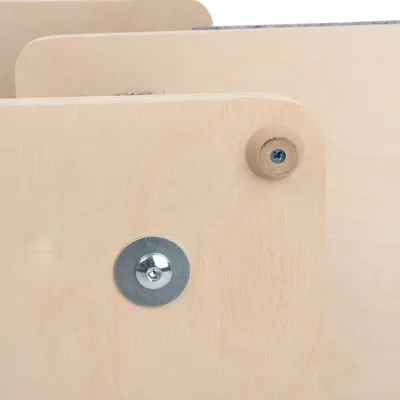 Close-up view of a wood joint with screws and metal washers, showing the product's construction.