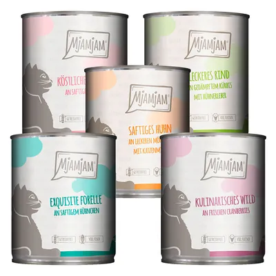 Fünf Mjamjam Dosen: Köstliches Kalb, Saftiges Huhn, Leckeres Rind, Exquisite Forelle, Kulinarisches Wild. Sichtbar: getreidefrei, viel Fleisch oder viel Fisch.