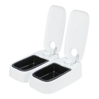 Distributore automatico doppio per alimenti, due scomparti neri con coperchi bianchi aperti, struttura in plastica. Nessun marchio visibile.